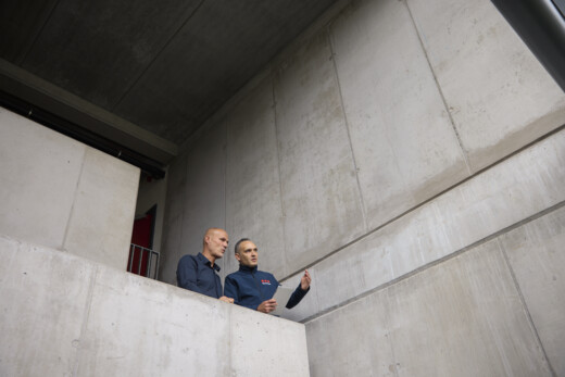 Fire safety specialists conducting a site assessment and reviewing fire safety requirements within an industrial facility.