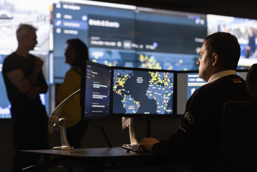 Securitas Risk Intelligence advisor working at a computer in an intelligence centre.