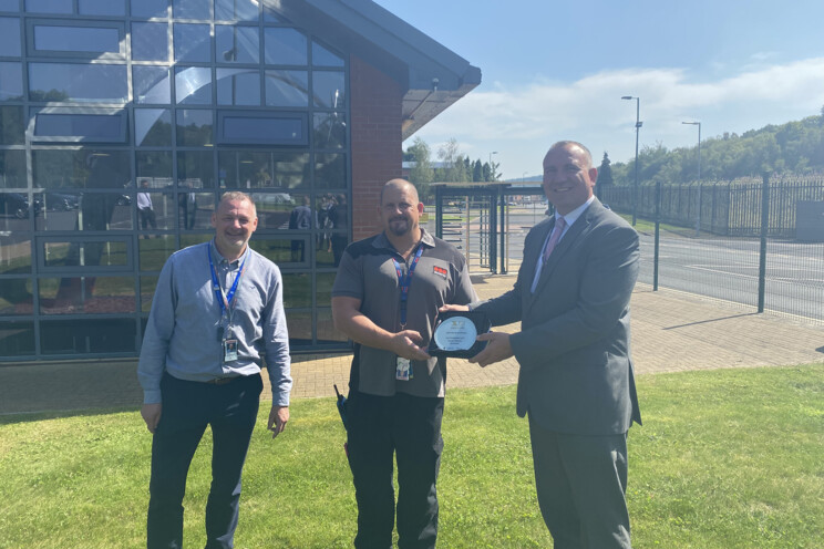 Paul Hemmings, BAE Systems Site Operations Manager and Shaun Kennedy, Country President, Securitas UK present Denzil with his Outstanding act award.
