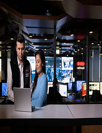Security professionals analyzing risk intelligence and operational information to support informed security decision-making.