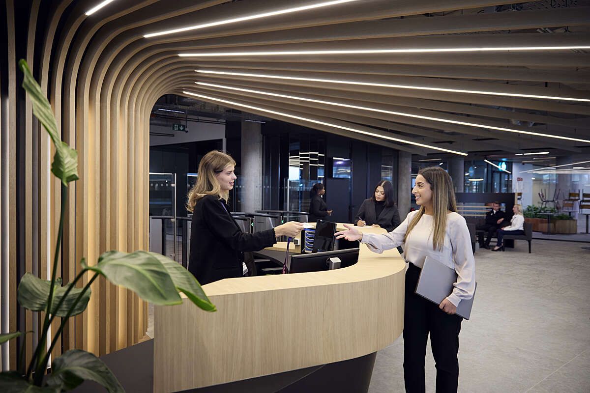 Securitas receptionists with a tablet