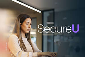 Securitas employee on her laptop in a conference room.
