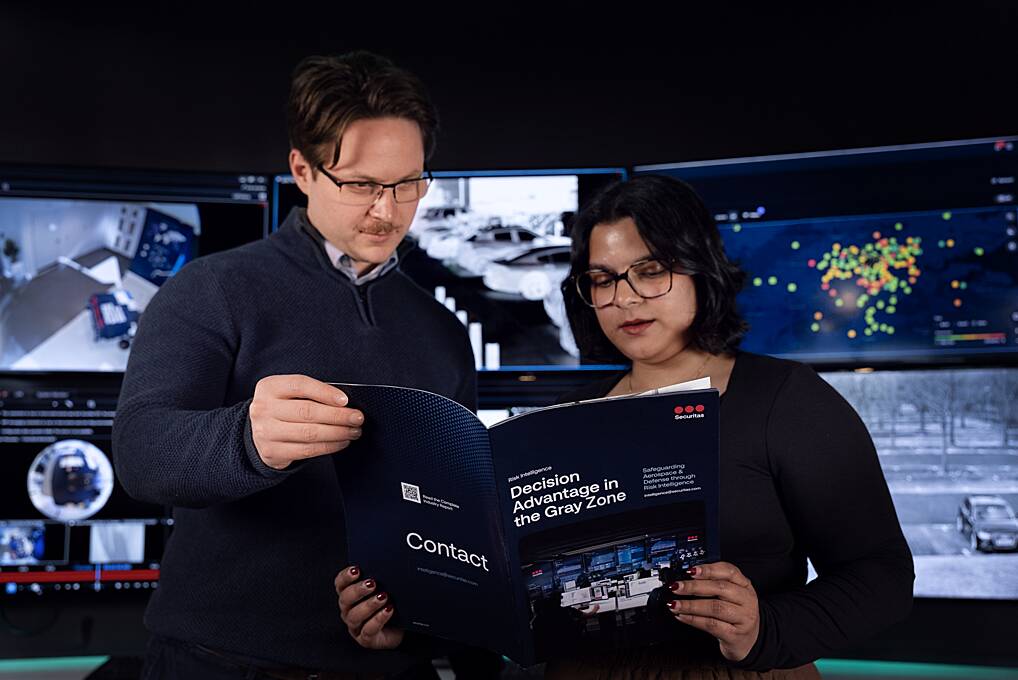 Securitas risk intelligence experts discuss risk management plans with clients in the aerospace and defense sector.