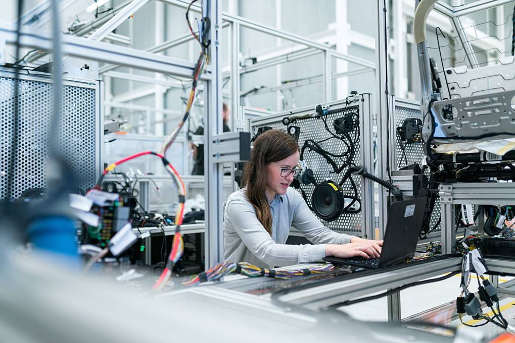 Female employee working on a manufacturing site in Ireland.