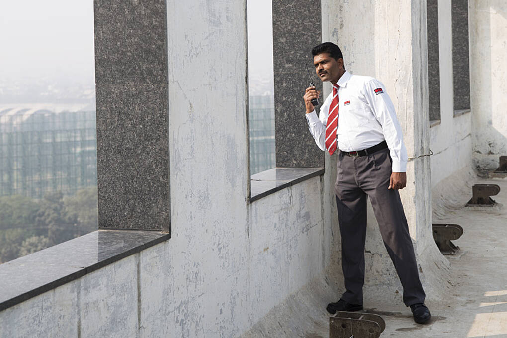 Security officer looking out of the window