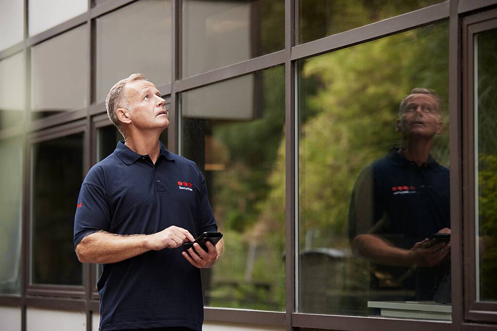 Security professional assessing a commercial facility as part of the development of a security solution tailored to organizational requirements.
