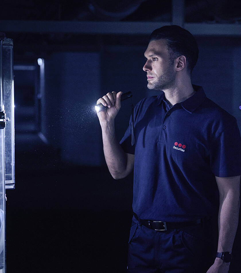Securitas employee performing a task using a VR training helmet