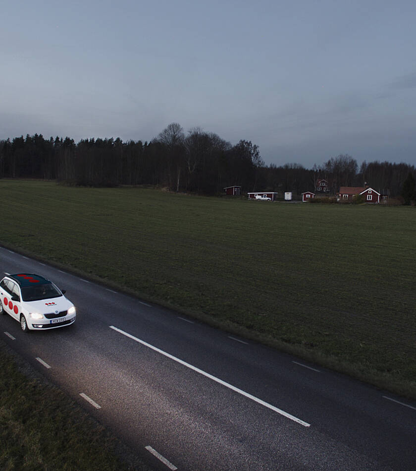 Securitas car driving on a country road