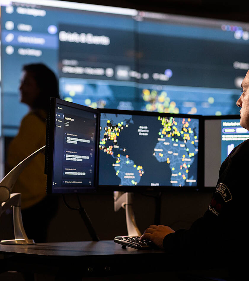 Security advisors check the security alerts and data on the world map