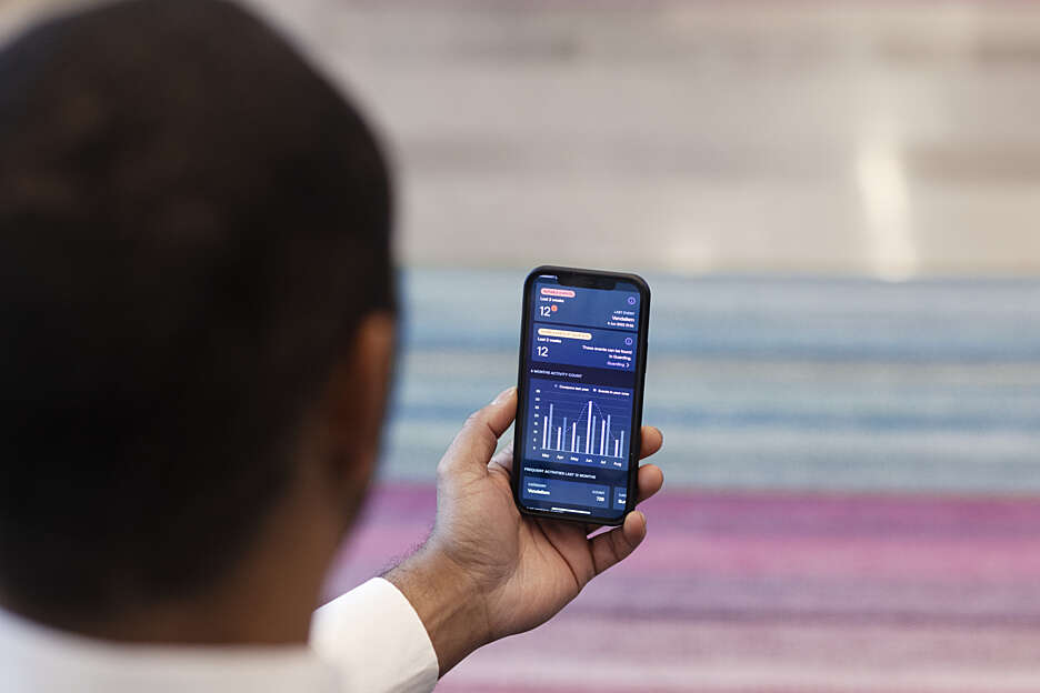 Securitas client reviewing report on the mySecuritas mobile app