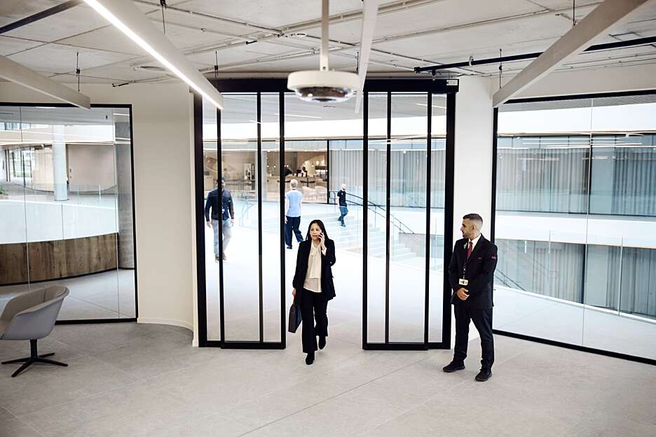 Security officer supporting access control and workplace security in a modern office building.