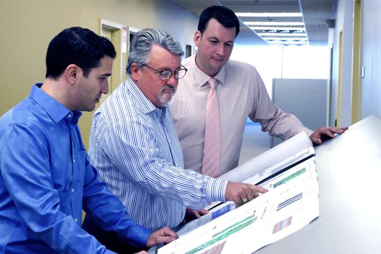 Electronic Security colleagues reviewing a security system design Electronic Security colleagues reviewing a security system design