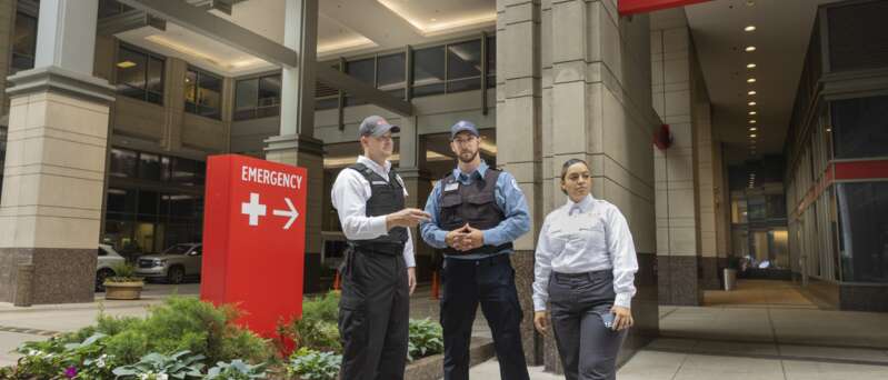 Securitas security officers outside of hospital entrance